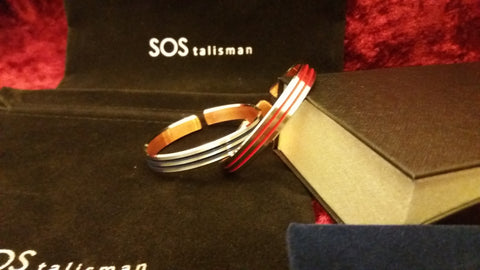 Copper bangle made of rhodium with coloured stripe.  Red, dark blue and black   code 915 and chose colour